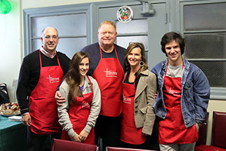 A group of volunteers smiling. Links to Gifts of Appreciated Securities