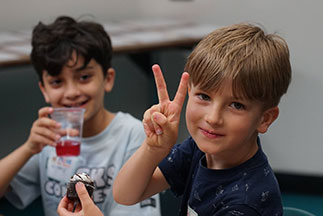 A boy holding up a peace sign. Links to Gifts That Protect Your Assets A boy holding up a peace sign. Links to Gifts That Protect Your Assets
