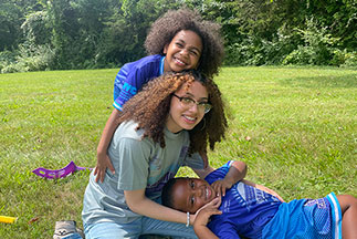 Three children playing outside. Links to Gifts That Pay You Income Three children playing outside. Links to Gifts That Pay You Income