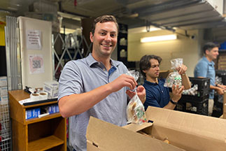 A volunteet packing bread in a box. Links to Gifts of Appreciated Securities A volunteet packing bread in a box. Links to Gifts of Appreciated Securities