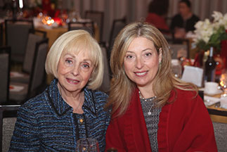 Two women smiling at a banquet. Link to Life Stage Gift Planner Under Age 60 Situations.
